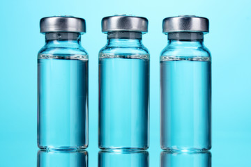 medical ampoules on blue background