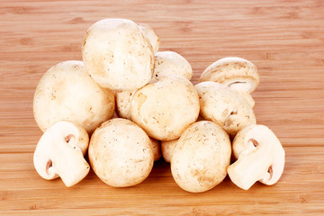 Champignon on wooden background