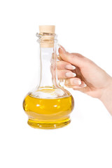 Hand and jug of oil