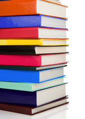 pile of new books isolated on white