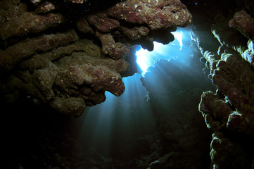 underwater caves with light beams
