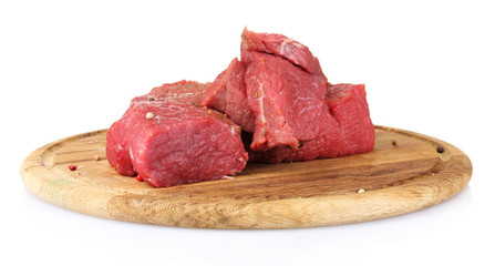 raw meat on wooden board isolated on white