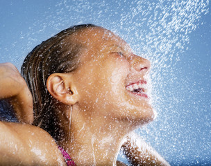 Happy Young Girl Taking Shower. Bath
