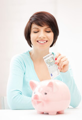 lovely woman with piggy bank and money
