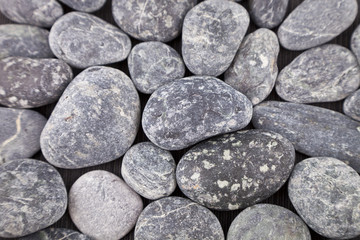 Fototapeta na wymiar Abstract background with round pebble stones