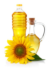 Jug and bottle of sunflower oil with flower isolated