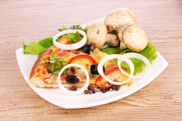 tasty pizza with olives on a wooden background