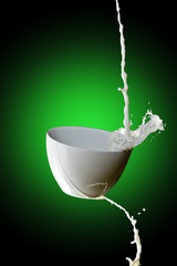 milk splash on a green