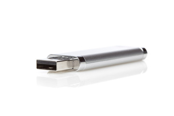 A silver USB jump drive