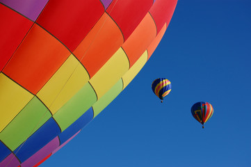 Two hot air balloons taking off