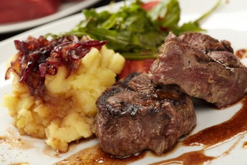 Beef steaks with vegetables