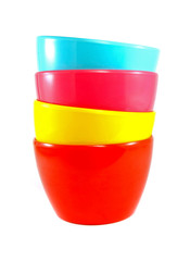 Stack of colorful plastic bowl on white background