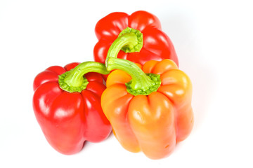 Orange and red pepper isolated on white