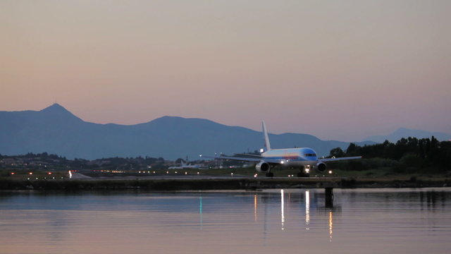 Driving of airplane before take-off, sunset scene, Corfu airport