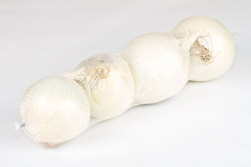 Ripe onion on a white