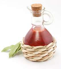 vinegar bottle and laurel leaf