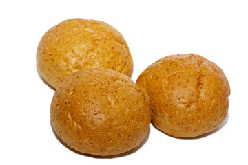 Loaf of bread and rolls isolated on white
