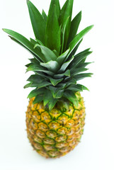 fresh pineapple fruits with green leaves