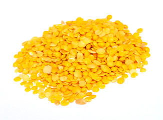 Yellow lentils isolated on white background.Macro shot