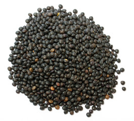 Heap of black lentil isolated on white