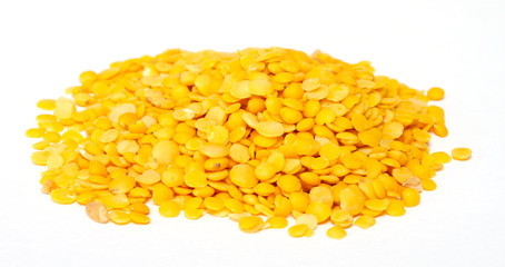Yellow lentils isolated on white background.Macro shot
