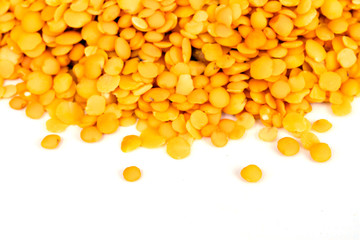 Yellow lentils isolated on white background.Macro shot.