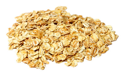 Heap of dry rolled oats isolated on white background