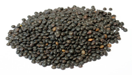 Heap of black lentil isolated on white