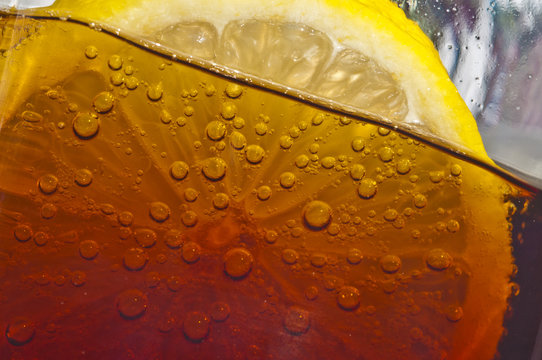 Thin slice of lemon in a fizzy cola drink