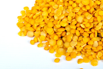Yellow lentils isolated on white background.Macro shot.