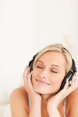 Fototapeta premium Portrait of a serene woman wearing headphones