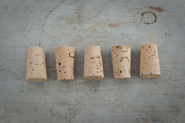 Cork stoppers on a wooden board
