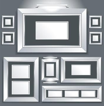 Symmetrical series of empty picture frames