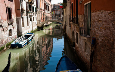 Shady Venetian canal, Italy.