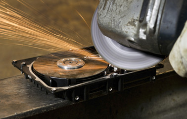 working with angular grinder on open hard drive