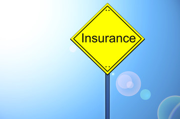 Insurance word on road sign