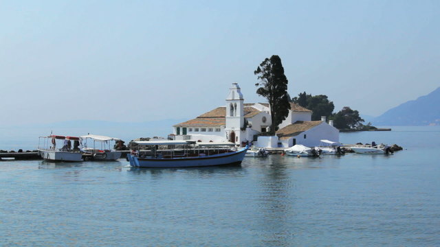Tourist boat near Vlacherna monastery, Kanoni, Corfu, Greece