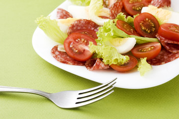 salad with salami and tomato
