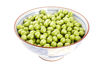 bowl of fresh green peas isolated on white background