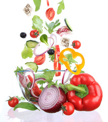 Fresh salad with ingredients in motion