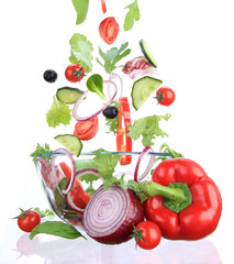 Fresh salad with ingredients in motion