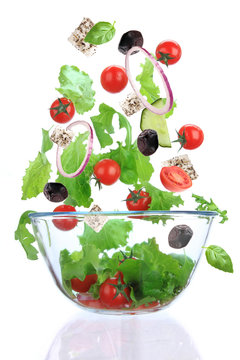 Fresh salad with vegetable in motion.