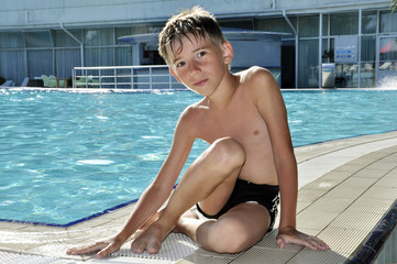 boy near the swimming pool