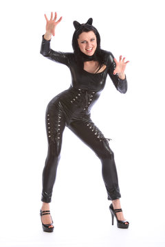 Sexy young woman in black full body pvc cat suit