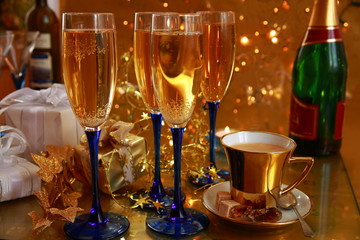 Champagne in glasses,gifts,bottles and coffee.