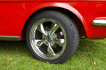 Front wheel of red classic car