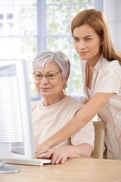 Mother and daughter browsing internet