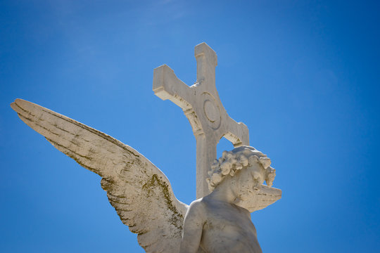 Angel against blue sky