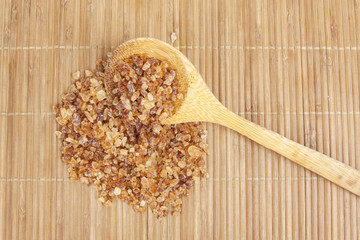 wood ladle sugar , rock sugar and wood ladle on japanese mat.