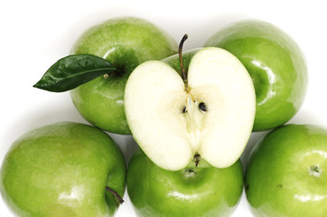 Green apple fruits and half of apple and green leaves